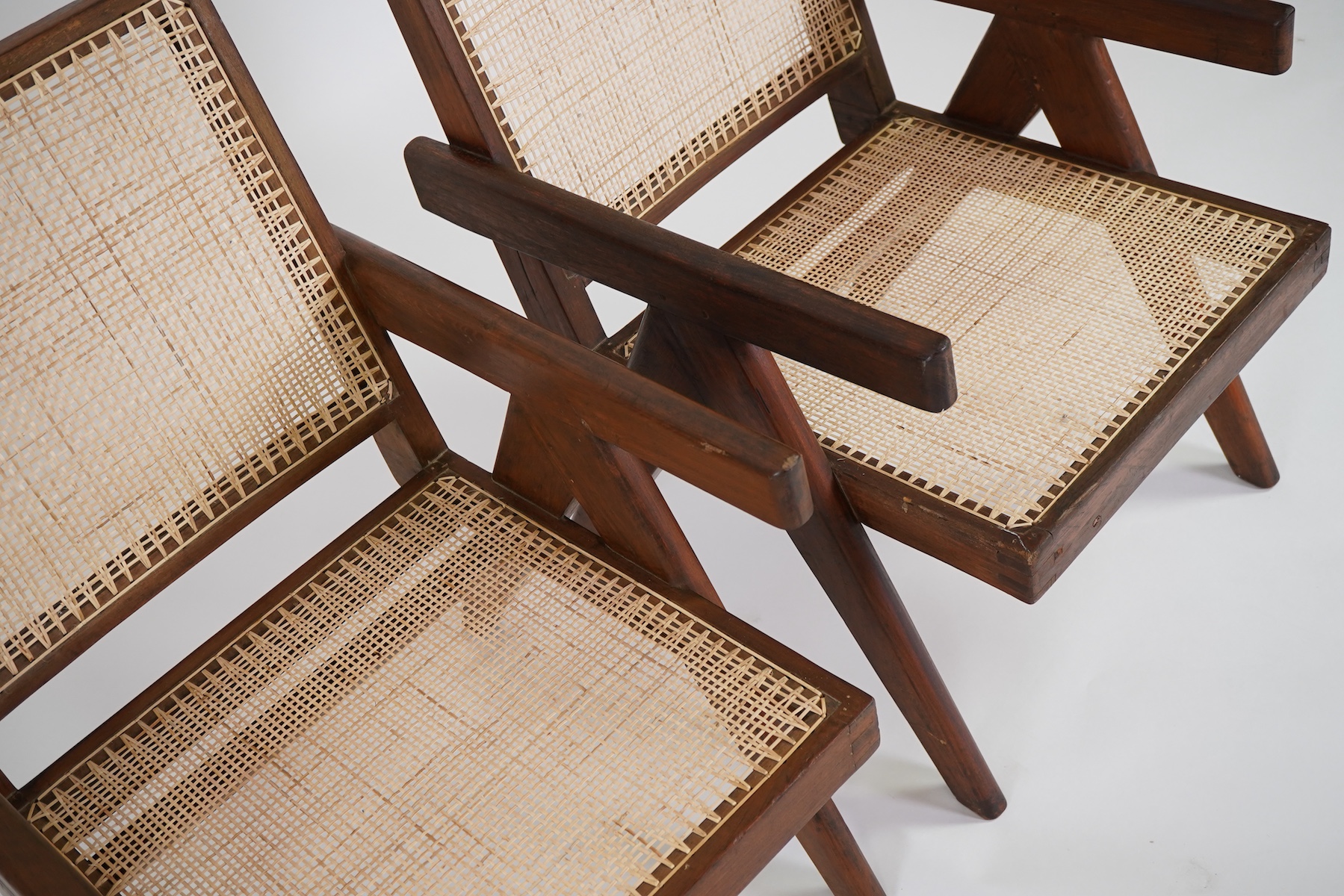 Pierre Jeanneret (Swiss, 1896-1967) for Chandigarh: A pair of cashew 'Easy' armchairs PJ-010105A